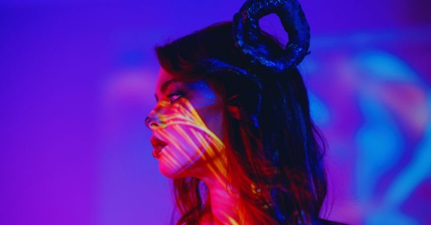 Aries woman showing bold personality traits with confidence and fire energy