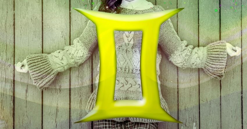 Gemini personality traits zodiac sign golden twins symbol held in hands