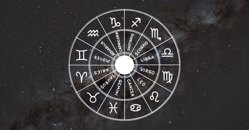 Silver zodiac wheel with a bright glowing center against a dark celestial background