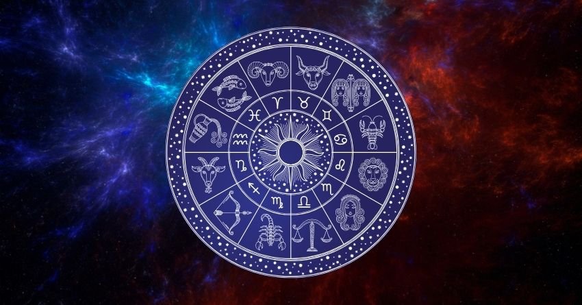 Purple zodiac wheel surrounded by glowing blue and red cosmic energy against a dark background