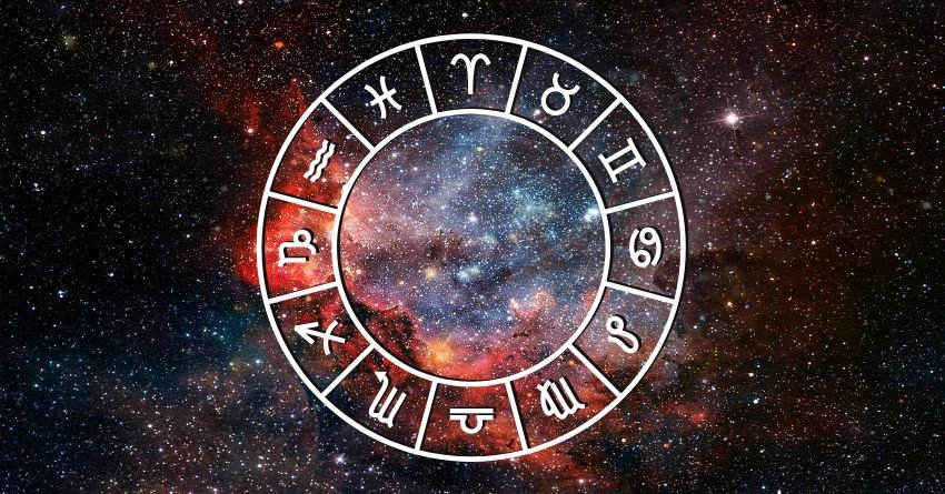Glowing zodiac wheel surrounded by fiery orange and red cosmic energy against a dark background