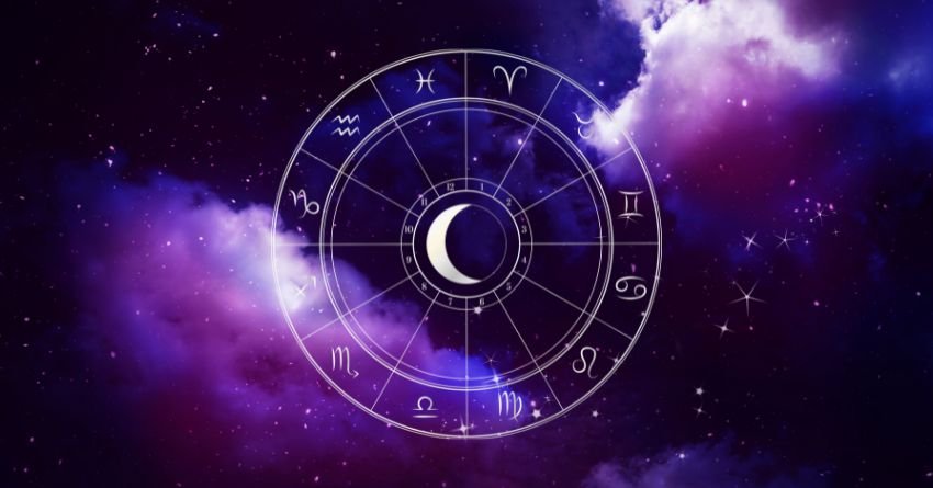 Glowing zodiac wheel surrounded by swirling purple and violet cosmic clouds
