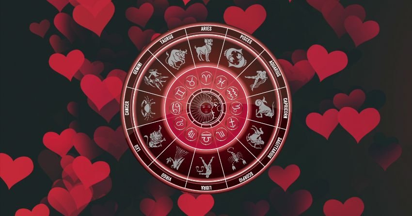 Red zodiac wheel surrounded by floating red hearts against a dark background