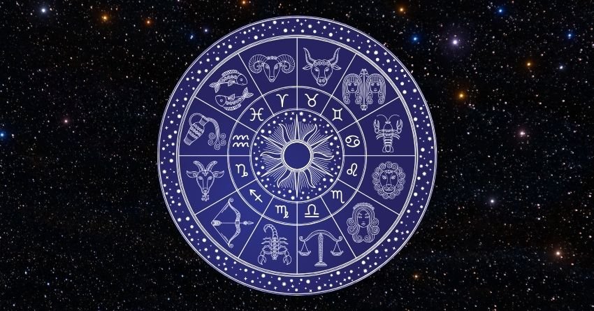 Glowing purple zodiac wheel with intricate astrological symbols against a dark cosmic background