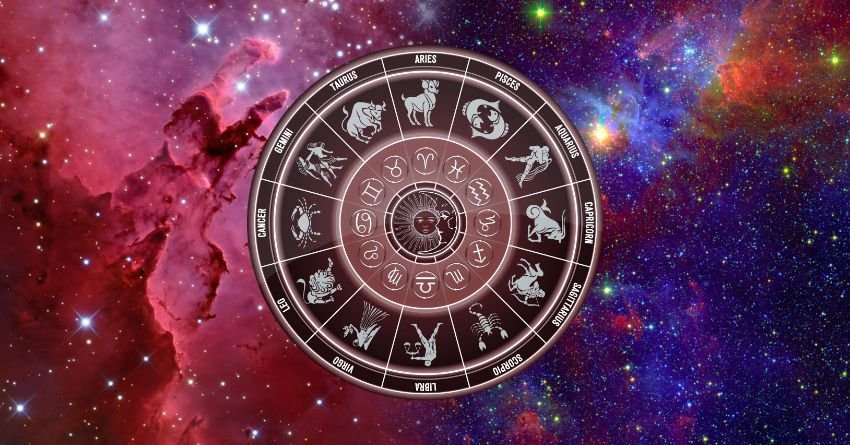 Red zodiac wheel surrounded by pink and purple cosmic clouds with glowing celestial energy