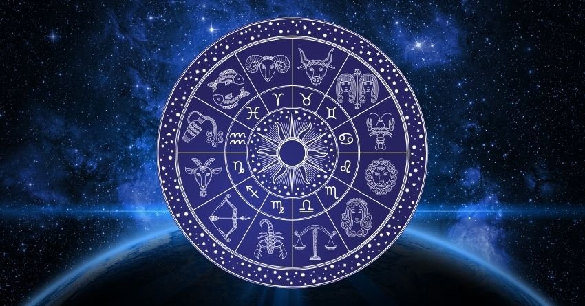 Purple zodiac wheel glowing against a dark blue cosmic background with swirling energy