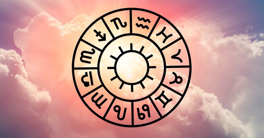 Golden zodiac wheel glowing against soft pink clouds and a bright sky