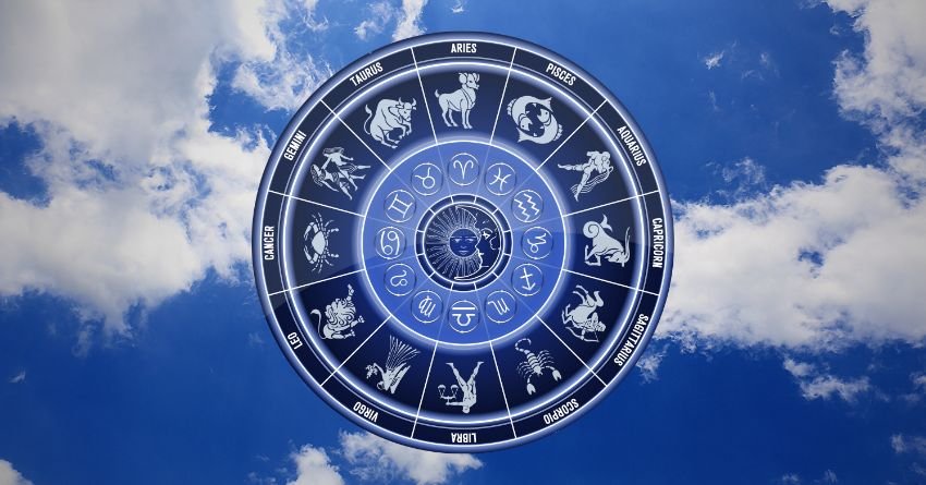 Blue zodiac wheel glowing among bright clouds and celestial light
