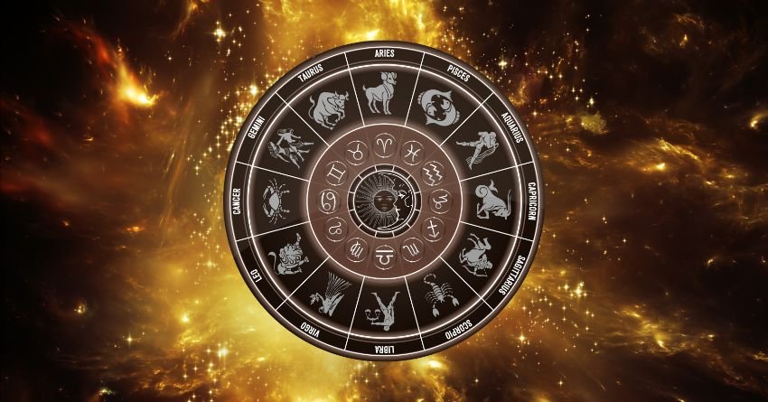 Golden zodiac wheel surrounded by fiery orange cosmic light on a dark background