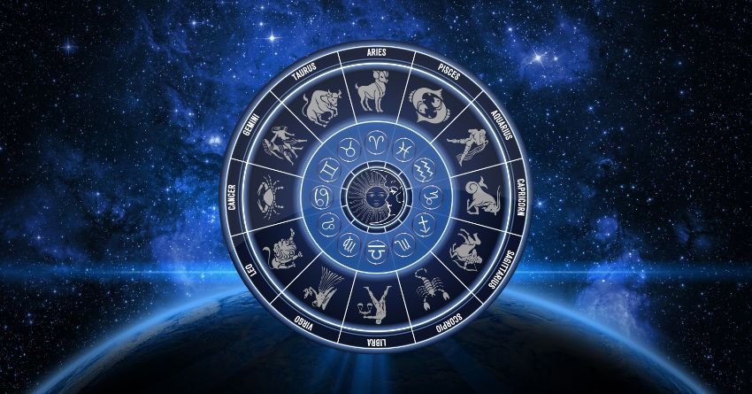 Blue zodiac wheel glowing on a dark cosmic background with radiant energy lines