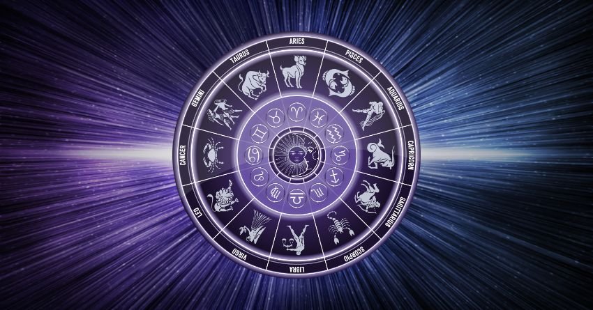 Zodiac wheel with all twelve zodiac signs surrounded by cosmic purple light