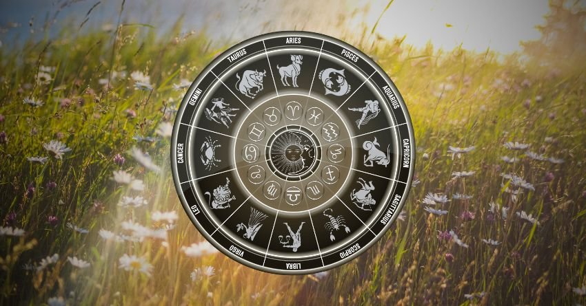 Glowing golden zodiac wheel surrounded by soft yellow light, dark clouds, and a mysterious celestial atmosphere