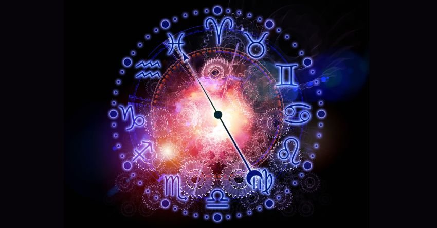 Glowing zodiac wheel surrounded by vibrant blue, purple, and pink cosmic energy with bright celestial lights
