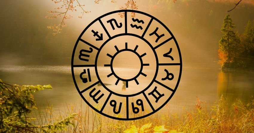 Glowing golden zodiac wheel against a warm yellow celestial sky with dramatic clouds and mystical light