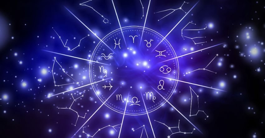 Glowing purple zodiac wheel surrounded by bright violet celestial lights, sparkling stars, and mysterious cosmic energy