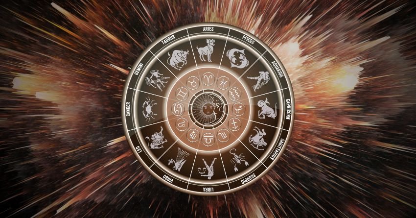 Golden zodiac wheel surrounded by radiant celestial rays and dark cosmic clouds